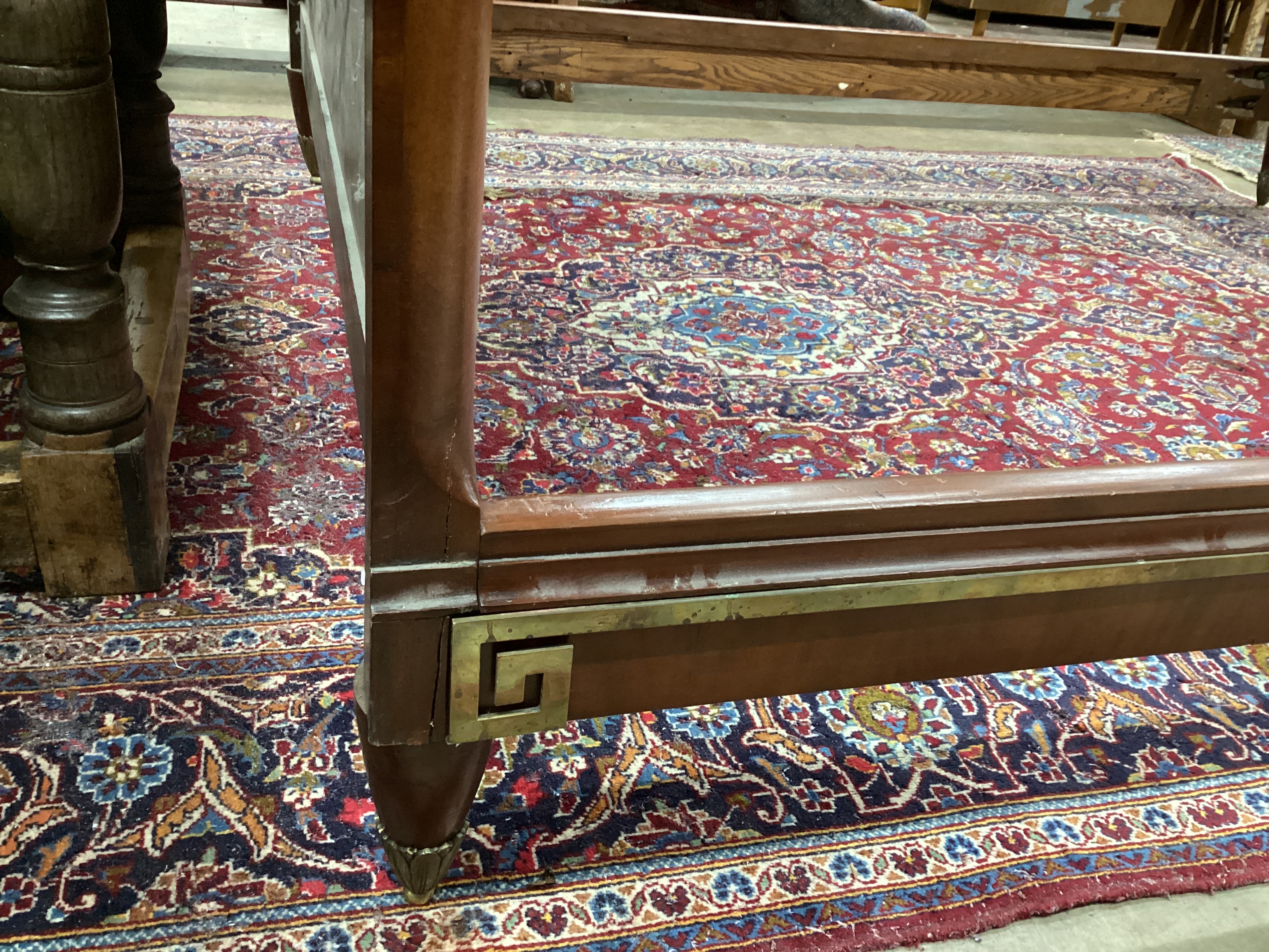 An early 20th century French walnut gilt metal mounted double bedframe, width 161cm, length 210cm, height 145cm